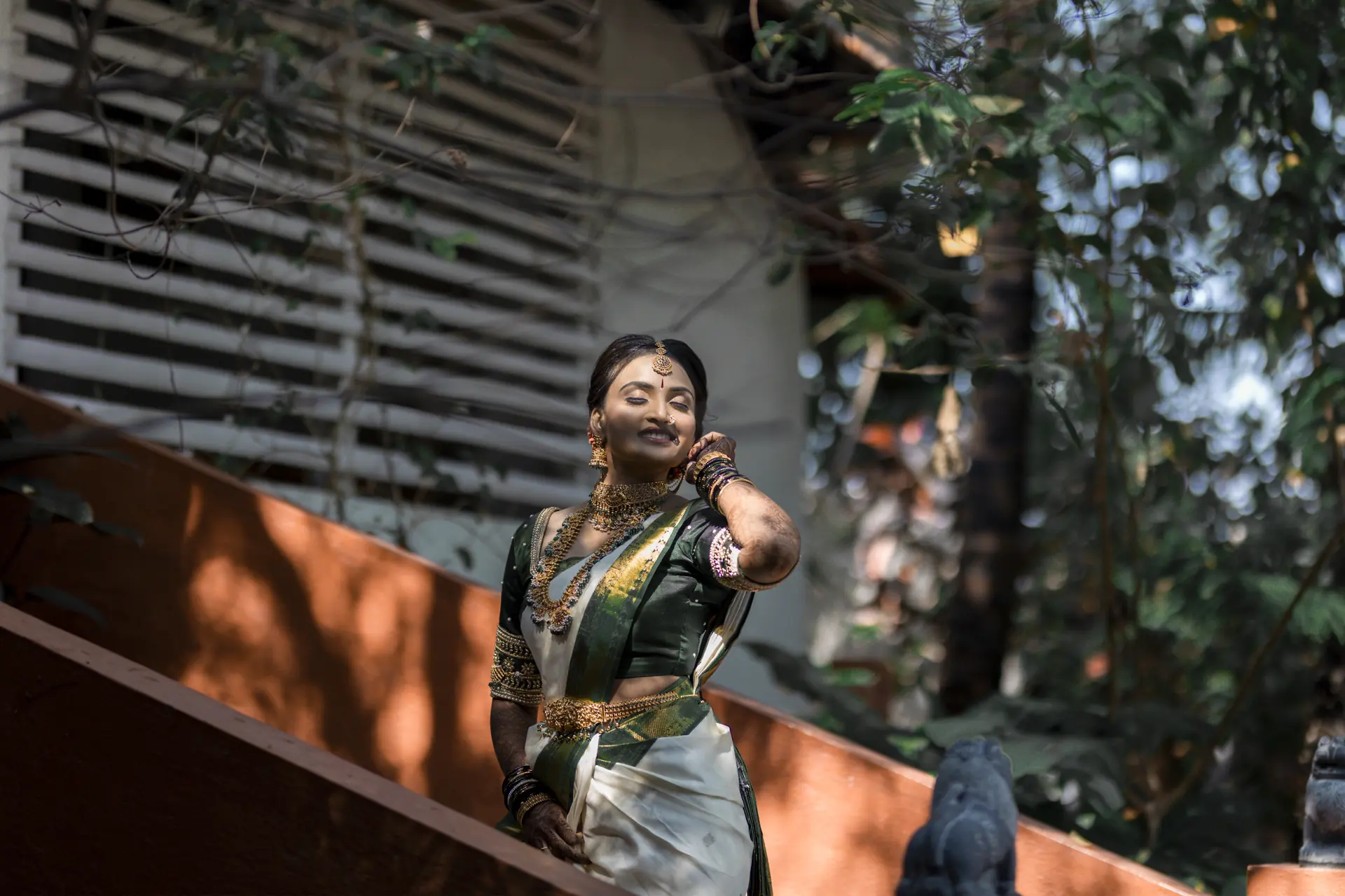 Candid bridal portrait in a green saree